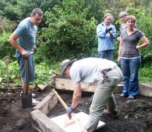 Garry checking angles on the firepit, well supervised